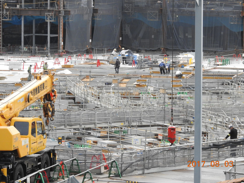 Construction of the New National Stadium using plywood concrete forms made from tropical timber. Image: Rainforest Action Network